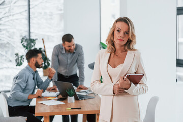 Sharing some ideas. Group of business people that working on the project in the office