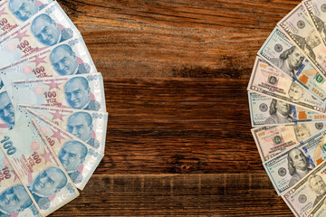 A lot of Turkish lira banknotes against dollar banknotes. Turkish economy, exchange rate, stock market, financial news concept.