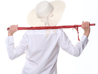 woman in white shirt and hat holding red whip on white