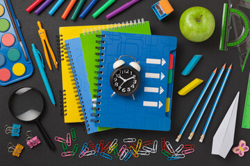 School learning concept with flat lay of school and stationery items
