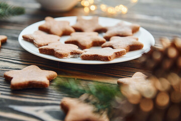 Cookies is on the plate. Christmas background with holiday decoration