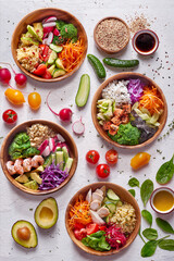 Bowls on a white background decorated with vegetables
