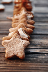 Cookies laying down in a row. Christmas background with holiday decoration