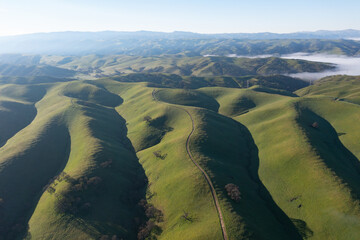 Early morning light shines on the rolling hills and valleys of the Tri-valley area of Northern California, just east of San Francisco Bay. This region is known for its vineyards and open space.