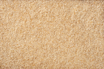 Full frame food background of whole psyllium husk, top view.