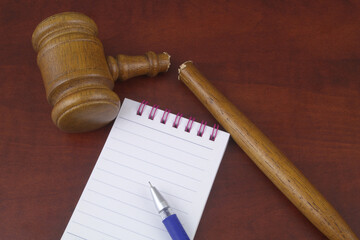 Creating new legal system. Notepad with pen and broken judge gavel.	