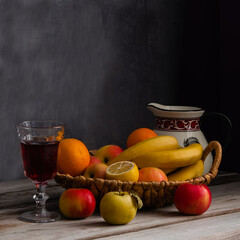 Still life with fruit in wicker basket.