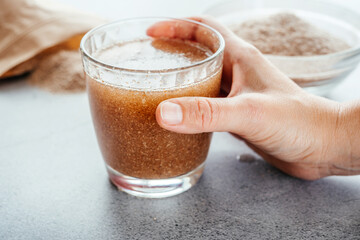 A glass of water soluble psyllium husk dietary fiber supplement, healthy diet morning routine