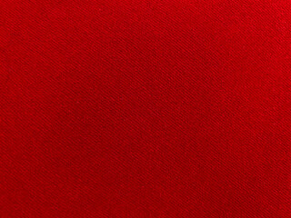 Red velvet fabric texture used as background. Empty red fabric background of soft and smooth...