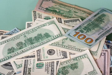 Wealth. A lot of money American paper banknotes. Background from money on a green background.
