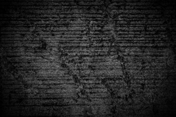 Wall grunge black concrete with light background. Dirty,dust wall concrete blackboard texture and splash white color space for text or abstract background.