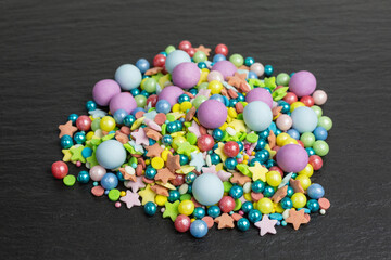 colorful sugar sprinkles in different sizes with stars and balls