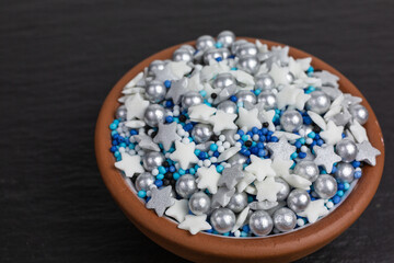 sugar sprinkles in white, silver and blue with stars and balls