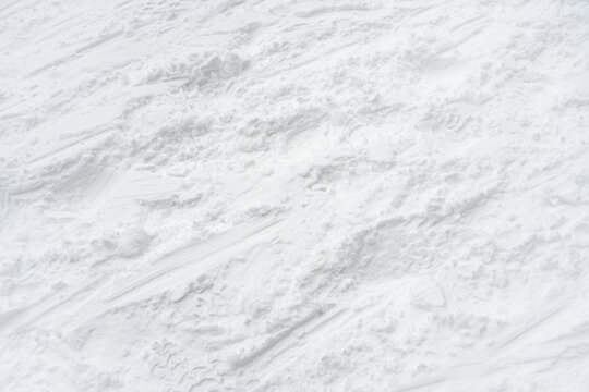 Snow texture background. Winter texture, snow background. Tracks on snow. 