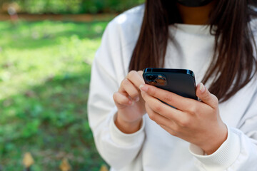 female hand holding a smartphone Technology concepts and communication devices
