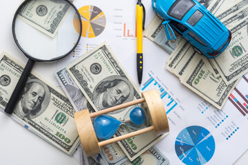 toy car and sheets drawings, money