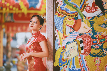 Beautiful Asian Chinese Woman Wearing Cheongsam Traditional Red Dress Fashion Posting Chinese Lunar New Year.