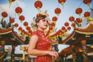 Beautiful Asian Chinese Woman Wearing Cheongsam Traditional Red Dress Fashion Posting Chinese Lunar New Year.