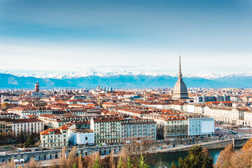 Fototapeta na wymiar Panoramic view of the historic center of Turin (Italy) with the Mole Antonelliana overlooking the city with the snow-capped alps on the background.