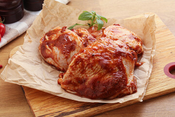 Marinated chicken leg in tomato sauce