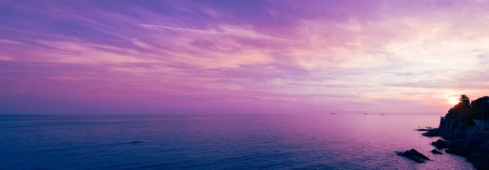 Fototapeten Ligurien Coast of Liguria. Mediterranean Sea at sunset, Italy. Sea panorama extra wide  © patma145
