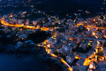 View of the city of Bogliasco from the air. Night light. Italy. - 482421023