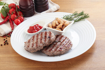 Grilled beef burger cutlet with sauce
