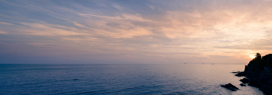 Coast of Liguria. Mediterranean Sea at sunset, Italy. Sea panorama extra wide