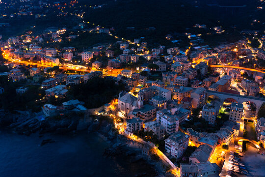 View of the city of Bogliasco from the air. Night light. Italy.