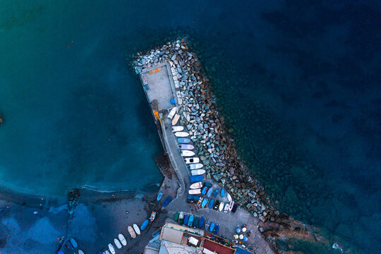 Beach on the Mediterranean coast. Italy. Pier aerial view.