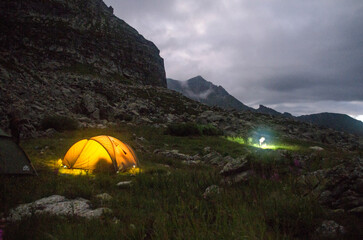 Tent on the background of night mountains. Caucasus