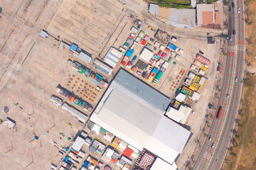 Aerial top view of Night Market people walking street, Colorful tents in the train of Ratchada at Bangkok city, Thailand. Retail shops