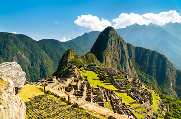 Ruins of ancient Incan city of Machu Picchu. UNESCO world heritage in Peru - obrazy, fototapety, plakaty