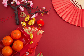 Chinese new year festival decorations. Orange, red packet, plum blossom and lucky money....