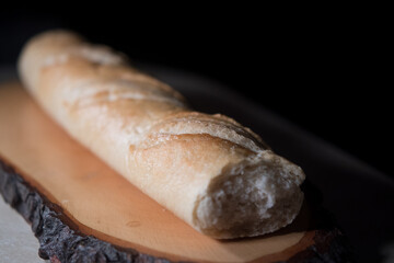 loaf of bread on wooden tray