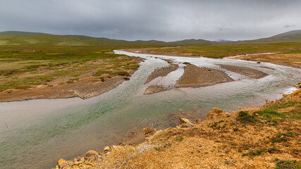 River meandering in the hills of the Tibetan plateau, Qinghai province, China