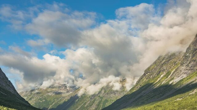 Timelapse of clouds creeping up a mountain range in west Norway in early morning light