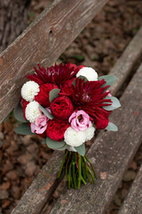 Wedding bouquet . The bride's bouquet. Bouquet of red flowers. Bridal douquet composed of dahlia and roses.