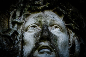 Fototapeta na wymiar Antique statue Jesus Christ in a crown of thorns. Retro styled image.