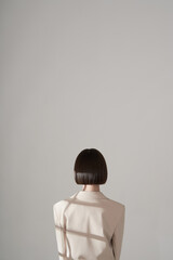 Beautiful brunette with graphic bob haircut wear beige fashion pantsuit - 482430098