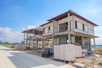 Naklejka premium construction residential new house in progress at building site housing estate development