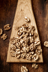 Peeled walnuts. On a wooden background. Healthy food. Natural background.