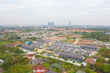 Aerial view of residential neighborhood with under construction site. Urban housing development from above. Top view. Real estate in urban city town. Property real estate.