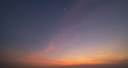 Sunset sky. Abstract nature background. Dramatic blue with orange colorful clouds in twilight time.
