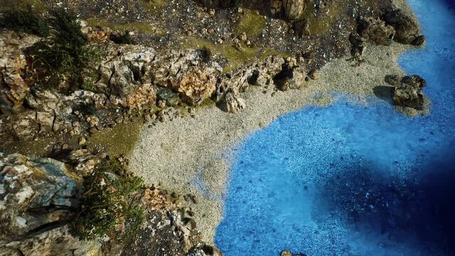 aerial view from flying drone of rocky island in Atlantic ocean