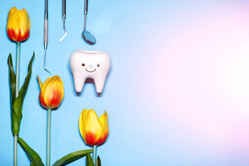 Stomatology concept.eggs, dentist tools and teeth figurines.Dental spring summer concept.