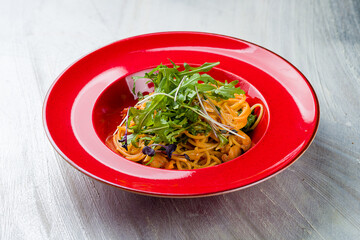 Pasta spaghetti with shrimps and creamy sauce on bowl on grey table