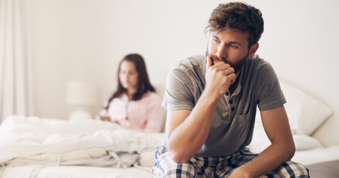 He said, she said. Shot of a young couple having an argument in the bedroom at home.