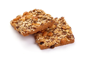 Cookies with nuts and seeds of peanut, sunflower seeds, sesame, linen, organic food, isolated on white background.