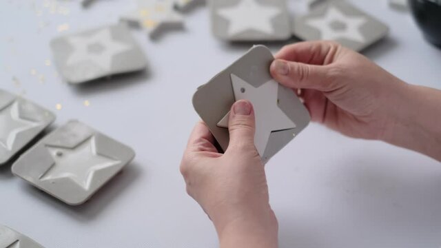 craftswoman makes plaster blanks for Christmas crafts. creativity at home. DIY home decor